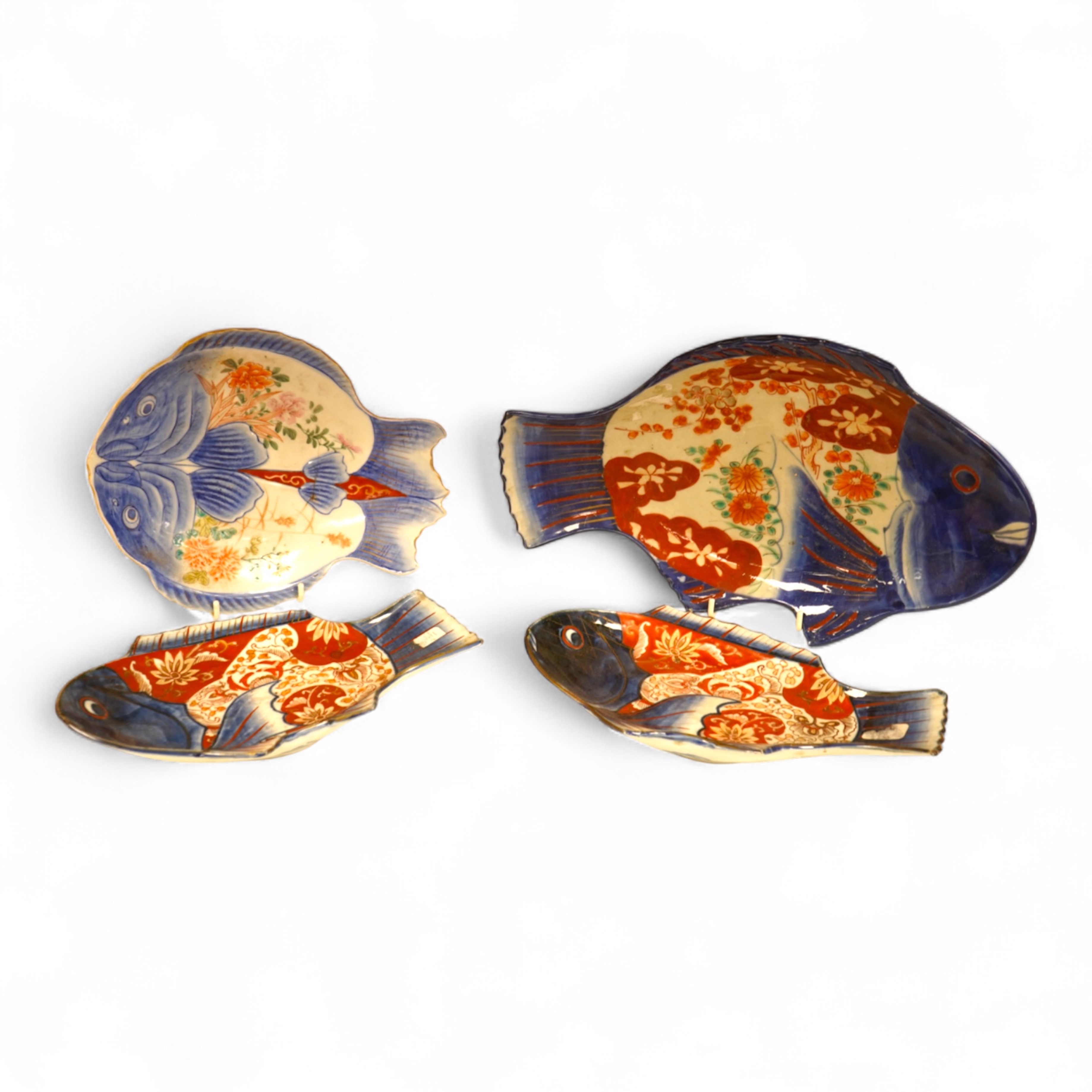 Four Japanese Imari fish-shaped dishes, largest 32cm wide